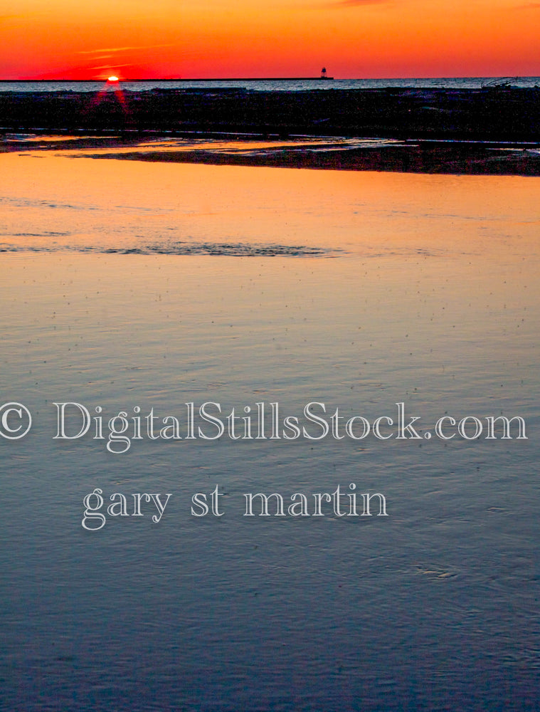 Sunset painting a red sky along the water, digital Grand Marais