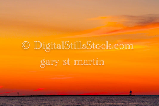 Lighthouse in the distance against an orange sky, digital Grand MArais