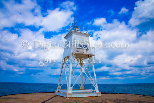 Looking up at the Harbor Light Against the Clouds, digital Grand Marais