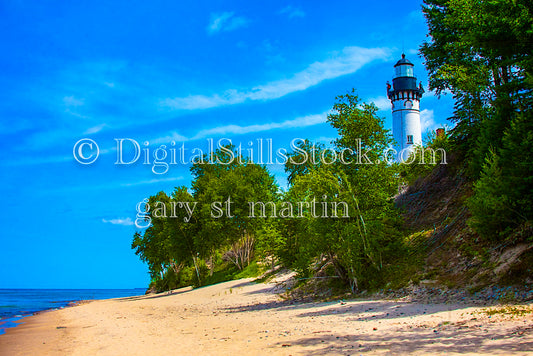 Wide view of the beach and Sable Lighthouse through the trees, digital Grand Marais