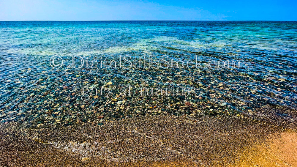 Wide view of colorful rocks underneath crystal clear water of Lake Superior, digital Grand Marais