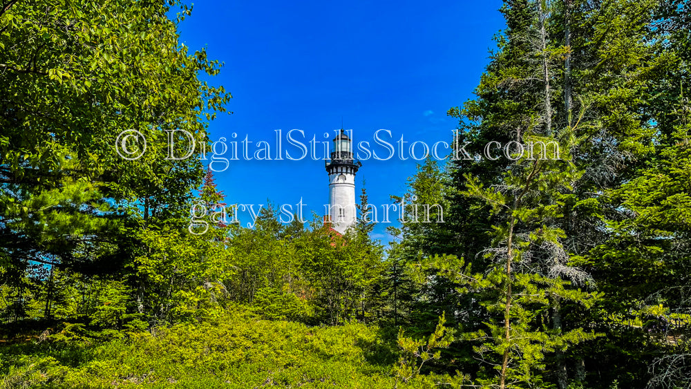 Sable Lighthouse peaking through the treetops, digital Grand MArais