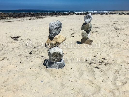 2 rock towers on the sand, digital sunset