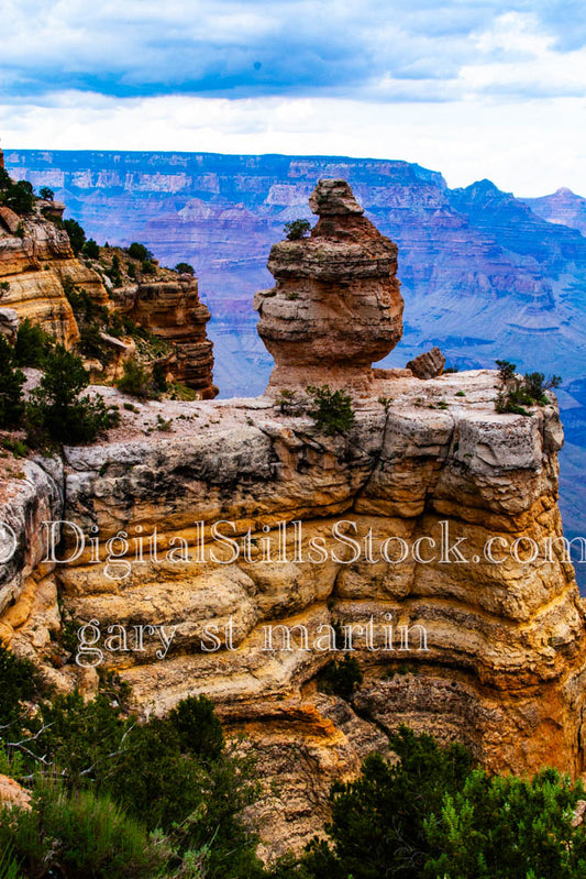 Tiered outcrop with large rock