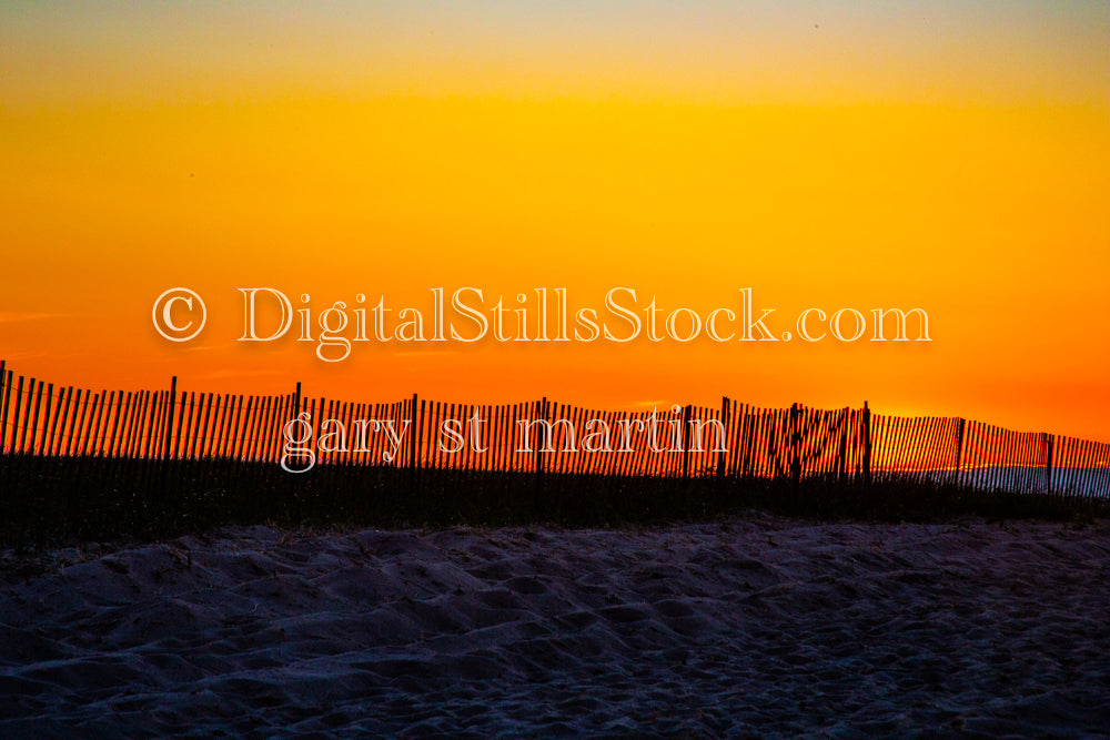 Snow and Sand fence line against an orange sky, digital Grand Marais