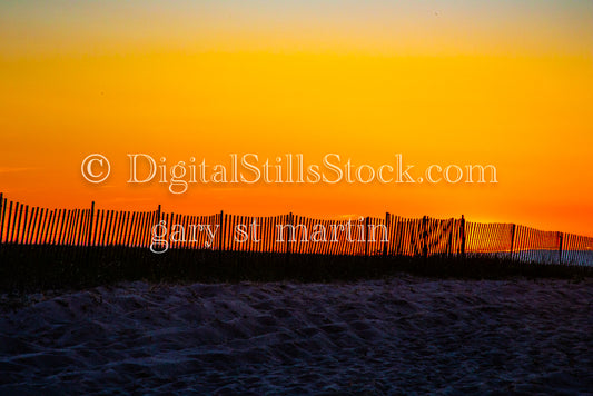 Snow and Sand fence line against an orange sky, digital Grand Marais