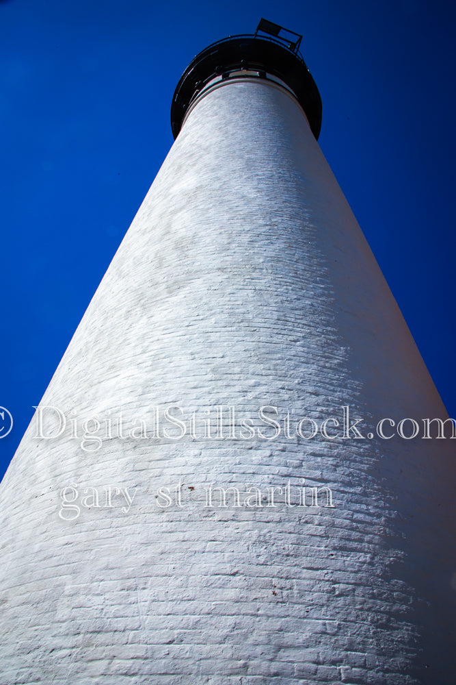 Looking up at the white bricks of Sable Lighthouse, digital grand marais