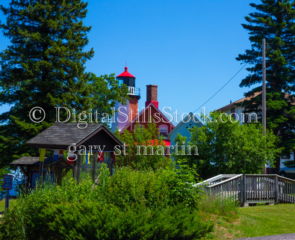 Red Lighthouse peaking through the trees, digital Copper Harbor