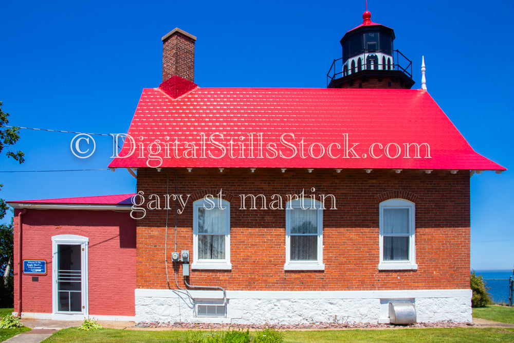 Red brick building with a red roof, digital copper harbor