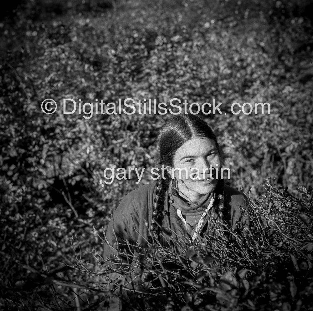 Caroline Braided hair, surrounded by flowers. San Francisco, CA,  analog, black & white, portrait