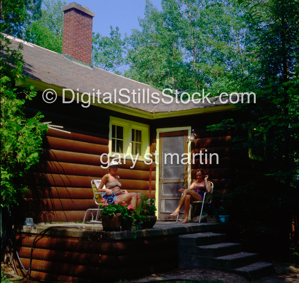 Two Women Sitting In The Front Porch
