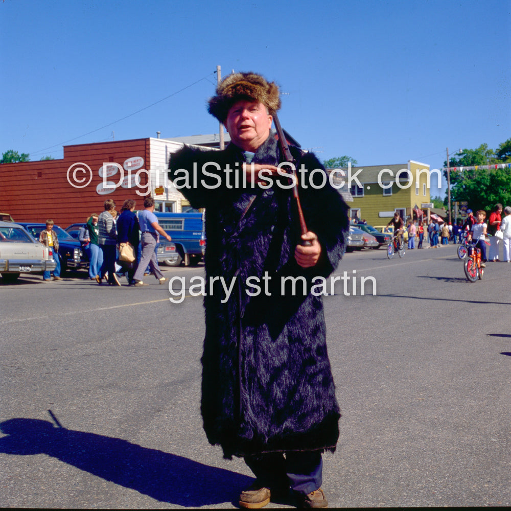 He stands, drunk at a 4th of July Parade, analog, color, portraits, men