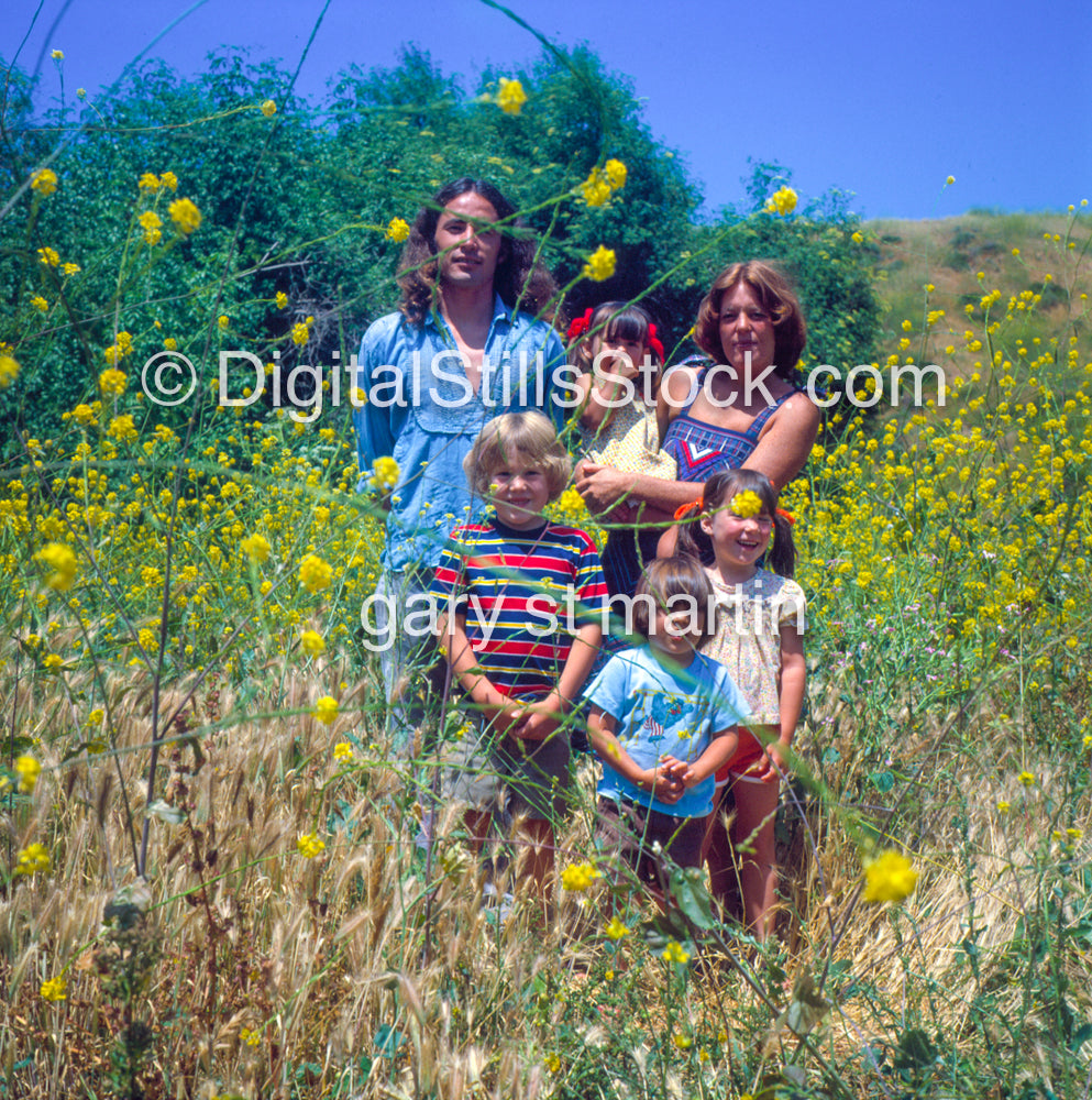 Family Portrait By The Yellow Flowers