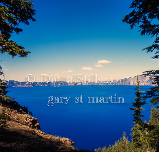 View from up top looking at the calm Crater Lake, analog Oregon