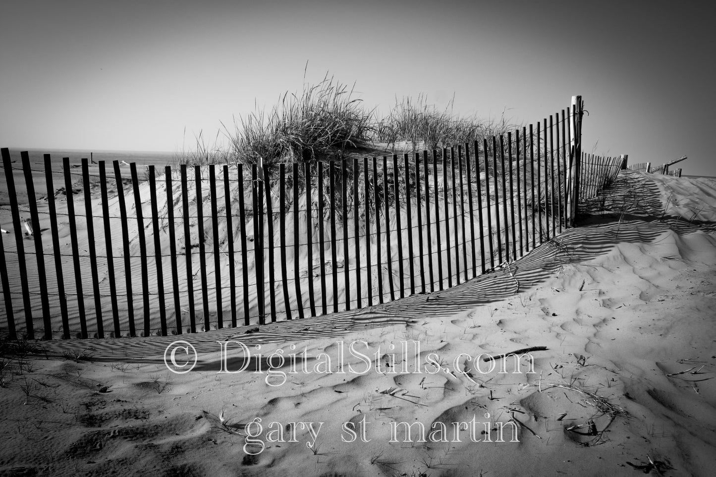 A Fence Along the Dunes